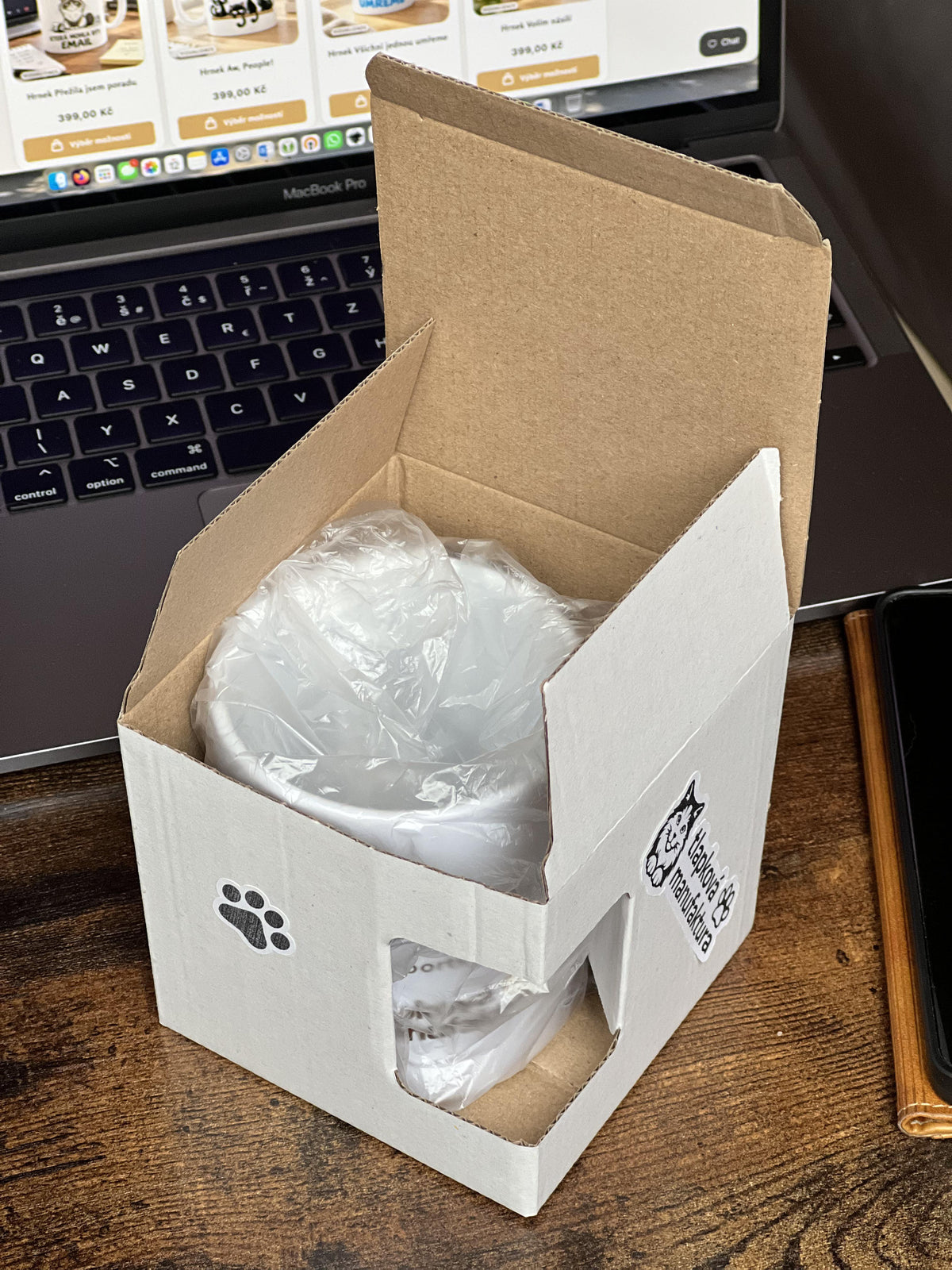 Ceramic mug packaging showing open box.